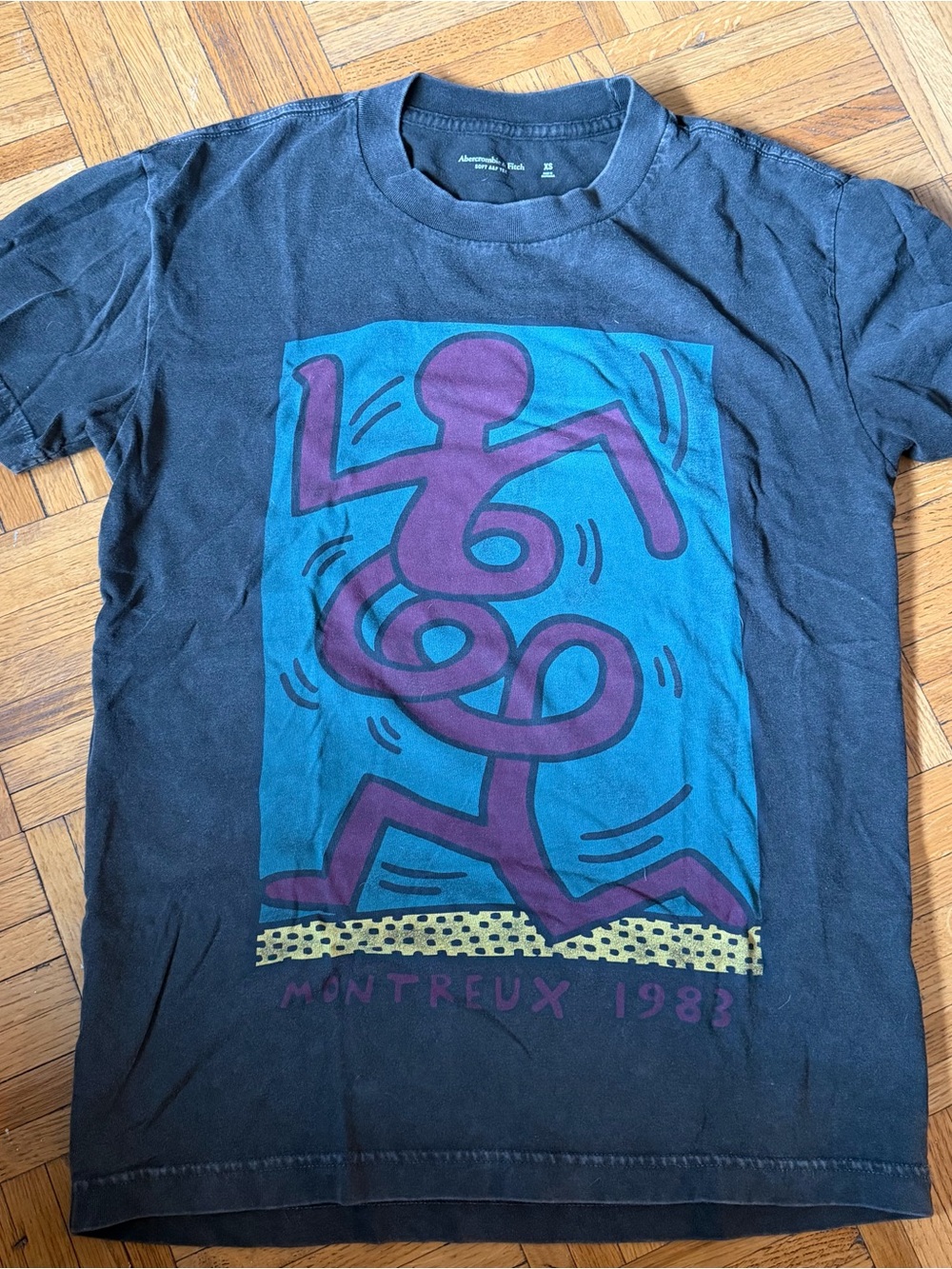 A&F x Keith Haring Montreux 1983 Graphic Black Tee